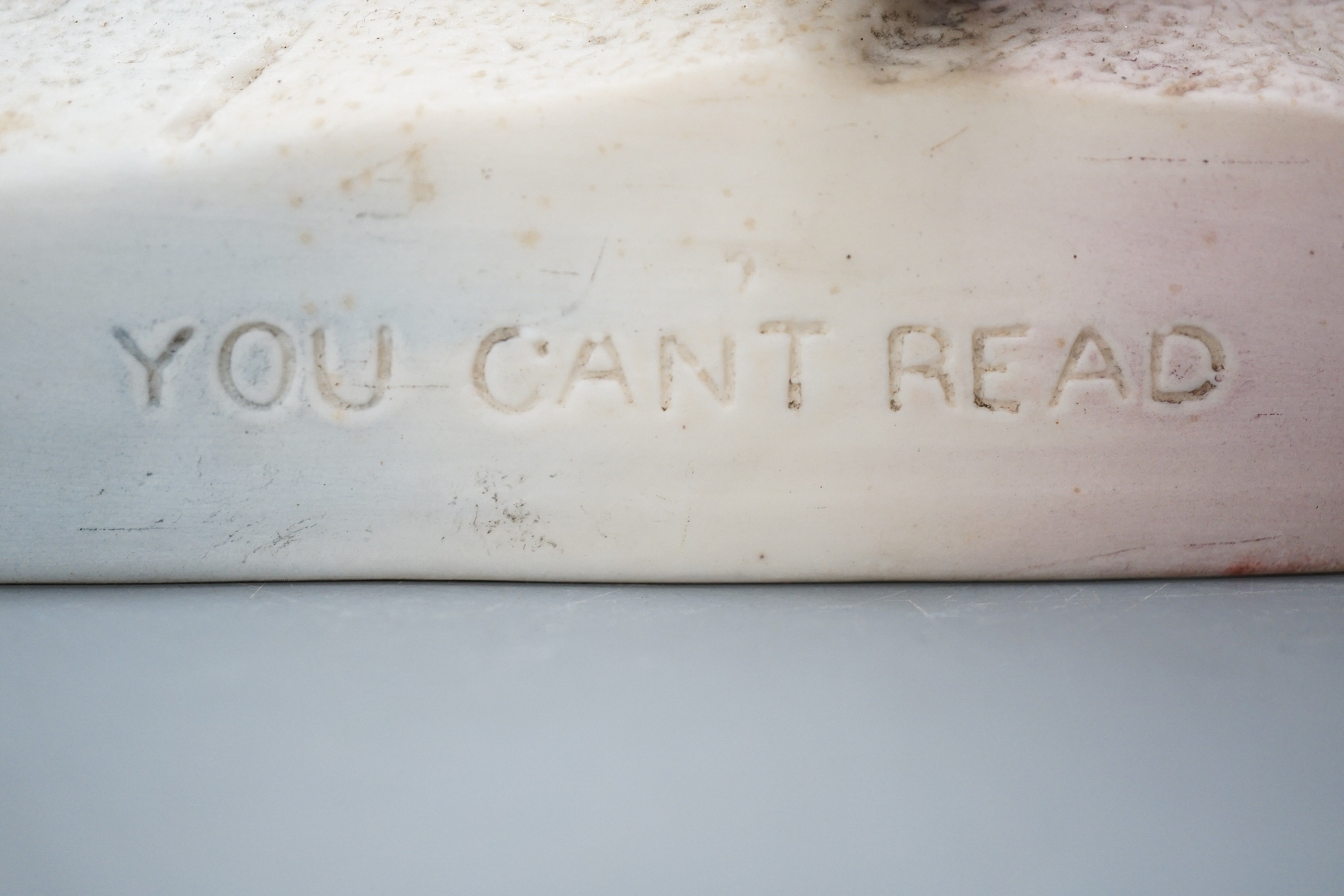 A late 19th Century Robinson & Leadbeater parian ware group ‘You Can’t Read’, 28 cms high.